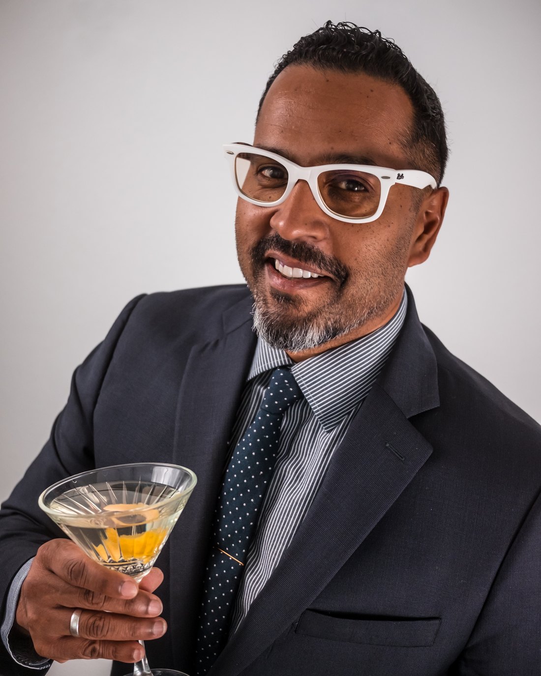 Harin W. holding a martini